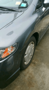 gray car paintless dent repair service